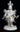 Front view of, "Little Fancy Dancer," cast paper sculpture by Patty Eckman featuring a young Native American dancing in full regalia.